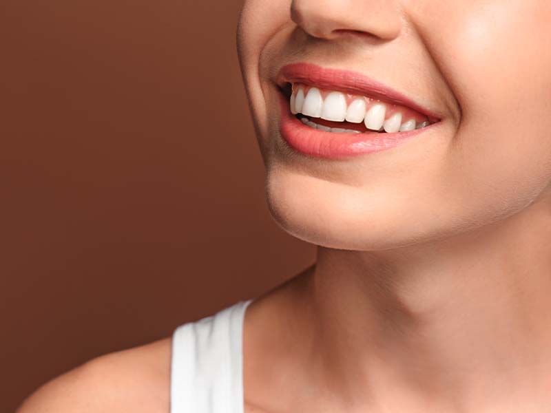 Close-up side view of a healthy white smile